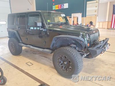 Czwarte zdjęcie samochodu z boku: 2011 JEEP WRANGLER UNLIMITED SPORT VIN:1J4BA3H19BL624136 - miniatura