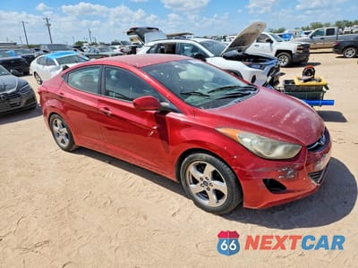 Czwarte zdjęcie samochodu z boku: 2012 HYUNDAI ELANTRA GLS VIN:5NPDH4AE6CH139598 - miniatura