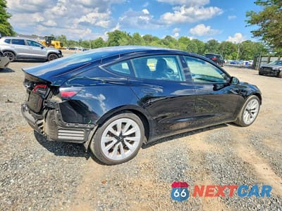 Trzecie zdjęcie samochodu z tyłu: 2023 TESLA MODEL 3 VIN:5YJ3E1EA3PF433667 - miniatura