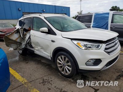 Czwarte zdjęcie samochodu z boku: 2017 FORD ESCAPE TITANIUM VIN:1FMCU0JD9HUD74660 - miniatura