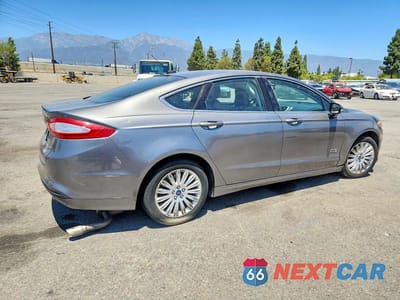 Trzecie zdjęcie samochodu z tyłu: 2014 FORD FUSION SE PHEV VIN:3FA6P0PUXER256237 - miniatura