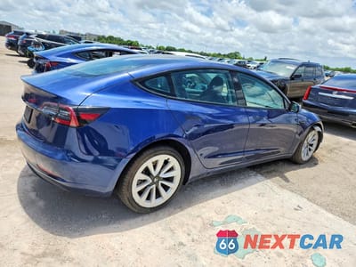 Trzecie zdjęcie samochodu z tyłu: 2023 TESLA MODEL 3 VIN:5YJ3E1EA5PF433931 - miniatura