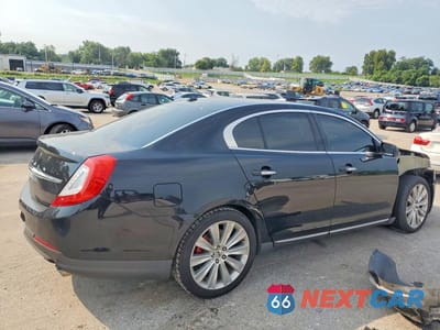 Trzecie zdjęcie samochodu z tyłu: 2016 LINCOLN MKS VIN:1LNHL9FT6GG600891 - miniatura
