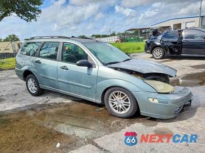 Czwarte zdjęcie samochodu z boku: 2003 FORD FOCUS SE VIN:1FAFP36383W213942 - miniatura