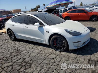 Czwarte zdjęcie samochodu z boku: 2021 TESLA MODEL 3 VIN:5YJ3E1ECXMF072225 - miniatura