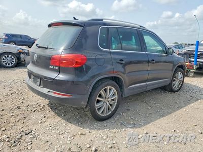 Czwarte zdjęcie samochodu z boku: 2014 VOLKSWAGEN TIGUAN S VIN:WVGAV3AX7EW548953 - miniatura