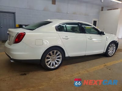 Trzecie zdjęcie samochodu z tyłu: 2012 LINCOLN MKS VIN:1LNHL9DR1CG805780 - miniatura