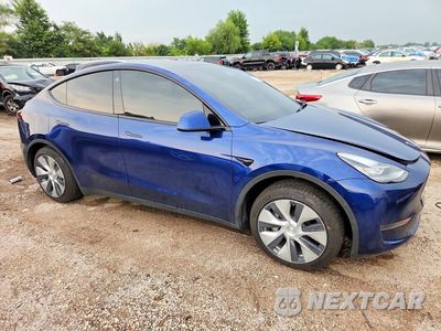 Czwarte zdjęcie samochodu z boku: 2023 TESLA MODEL Y VIN:7SAYGDEE5PF610503 - miniatura