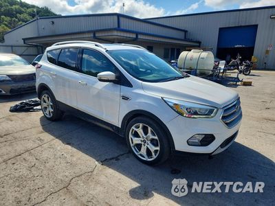 Czwarte zdjęcie samochodu z boku: 2017 FORD ESCAPE TITANIUM VIN:1FMCU9J98HUE21600 - miniatura