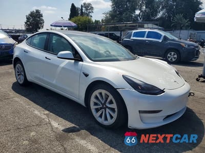 Czwarte zdjęcie samochodu z boku: 2022 TESLA MODEL 3 VIN:5YJ3E1EB7NF265344 - miniatura