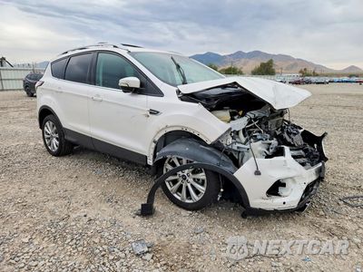 Czwarte zdjęcie samochodu z boku: 2017 FORD ESCAPE TITANIUM VIN:1FMCU9J91HUB62576 - miniatura