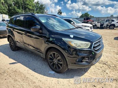 Czwarte zdjęcie samochodu z boku: 2017 FORD ESCAPE SE VIN:1FMCU0G91HUC71896 - miniatura