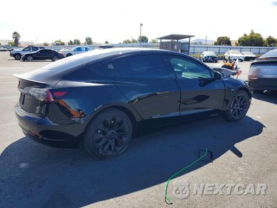 Trzecie zdjęcie samochodu z tyłu: 2021 TESLA MODEL 3 VIN:5YJ3E1EAXMF074992 - miniatura