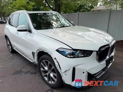 Czwarte zdjęcie samochodu z boku: 2026 BMW X5 XDRIVE40I VIN:5UX23EU06T9076795 - miniatura