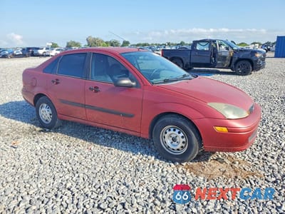 Czwarte zdjęcie samochodu z boku: 2004 FORD FOCUS LX VIN:1FAFP33P24W197357 - miniatura