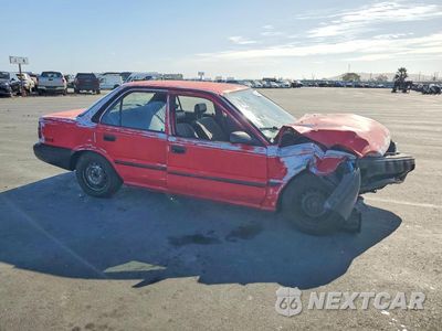 Czwarte zdjęcie samochodu z boku: 1990 TOYOTA COROLLA BASE VIN:1NXAE91A4LZ107708 - miniatura