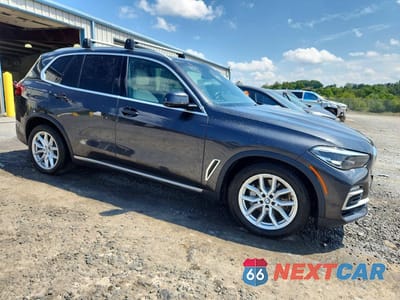 Czwarte zdjęcie samochodu z boku: 2021 BMW X5 XDRIVE40I VIN:5UXCR6C02M9E75055 - miniatura