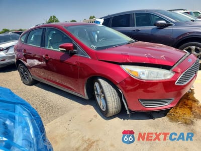 Czwarte zdjęcie samochodu z boku: 2017 FORD FOCUS SE VIN:1FADP3K2XHL205614 - miniatura
