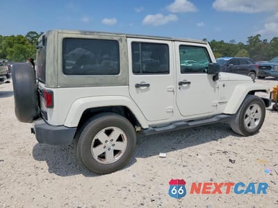 Trzecie zdjęcie samochodu z tyłu: 2010 JEEP WRANGLER UNLIMITED SAHARA VIN:1J4HA5H17AL221373 - miniatura