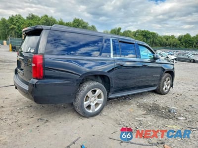 Trzecie zdjęcie samochodu z tyłu: 2017 CHEVROLET SUBURBAN K1500 LT VIN:1GNSKHKCXHR240034 - miniatura