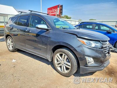 Czwarte zdjęcie samochodu z boku: 2018 CHEVROLET EQUINOX PREMIER VIN:3GNAXMEV0JS501659 - miniatura