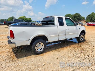 Trzecie zdjęcie samochodu z tyłu: 1999 FORD F150 VIN:1FTRX18W6XNA02463 - miniatura
