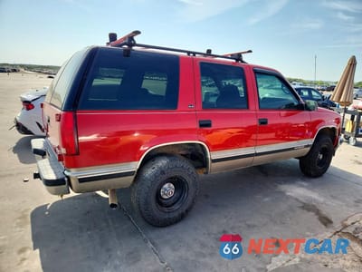Trzecie zdjęcie samochodu z tyłu: 1999 GMC YUKON VIN:1GKEC13R8XJ732463 - miniatura