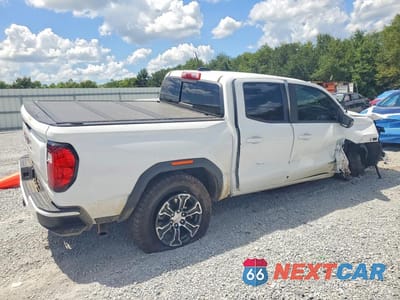 Trzecie zdjęcie samochodu z tyłu: 2024 GMC CANYON AT4 VIN:1GTP6DEKXR1320058 - miniatura