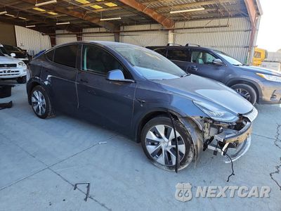 Czwarte zdjęcie samochodu z boku: 2022 TESLA MODEL Y VIN:7SAYGDEE3NF439697 - miniatura