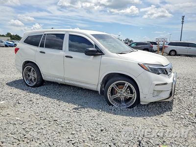 Czwarte zdjęcie samochodu z boku: 2019 HONDA PILOT LX VIN:5FNYF6H19KB074295 - miniatura