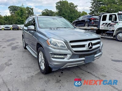 Czwarte zdjęcie samochodu z boku: 2016 MERCEDES-BENZ GL 450 4MATIC VIN:4JGDF6EE2GA678093 - miniatura