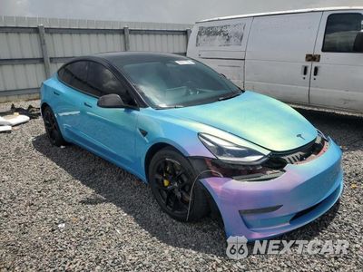 Czwarte zdjęcie samochodu z boku: 2022 TESLA MODEL 3 VIN:5YJ3E1EC5NF125303 - miniatura