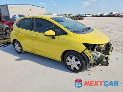 Czwarte zdjęcie samochodu z boku: 2016 HONDA FIT LX VIN:JHMGK5H55GX017169 - miniatura