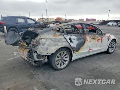 Trzecie zdjęcie samochodu z tyłu: 2023 TESLA MODEL 3 VIN:5YJ3E1EA0PF459787 - miniatura