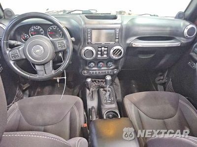 Zdjęcie 8 z 13 samochodu: 2013 JEEP WRANGLER UNLIMITED SAHARA VIN:1C4BJWEG0DL698502 - miniatura