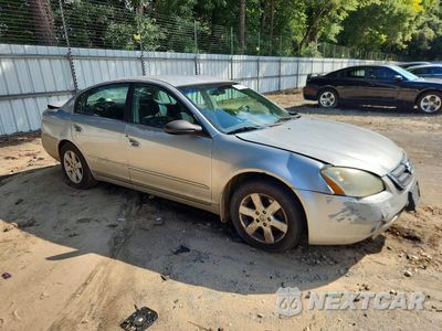 Czwarte zdjęcie samochodu z boku: 2002 NISSAN ALTIMA 2.5 VIN:1N4AL11D32C225992 - miniatura