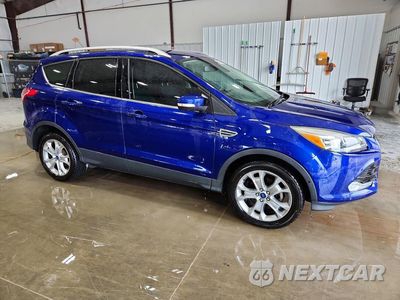 Czwarte zdjęcie samochodu z boku: 2014 FORD ESCAPE TITANIUM VIN:1FMCU0JX5EUD71566 - miniatura