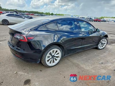 Trzecie zdjęcie samochodu z tyłu: 2023 TESLA MODEL 3 VIN:5YJ3E1EA1PF451794 - miniatura