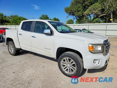 Czwarte zdjęcie samochodu z boku: 2016 GMC CANYON SLT VIN:1GTG5DE31G1350512 - miniatura