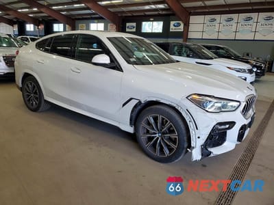 Czwarte zdjęcie samochodu z boku: 2021 BMW X6 XDRIVE40I VIN:5UXCY6C03M9E59823 - miniatura