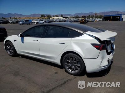 Trzecie zdjęcie samochodu z tyłu: 2023 TESLA MODEL 3 VIN:5YJ3E1EA0PF595742 - miniatura