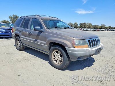 Czwarte zdjęcie samochodu z boku: 2002 JEEP GRAND CHEROKEE LAREDO VIN:1J8GX48S12C121959 - miniatura