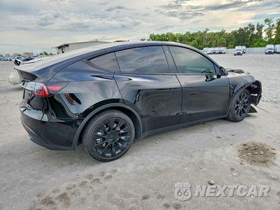 Trzecie zdjęcie samochodu z tyłu: 2023 TESLA MODEL Y VIN:7SAYGDEE4PA104562 - miniatura