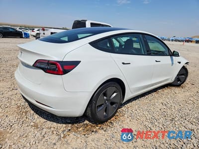 Trzecie zdjęcie samochodu z tyłu: 2023 TESLA MODEL 3 VIN:5YJ3E1EA3PF456687 - miniatura