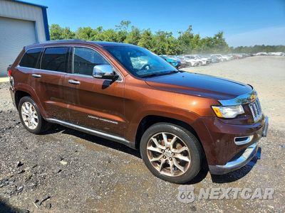 Czwarte zdjęcie samochodu z boku: 2014 JEEP GRAND CHEROKEE SUMMIT VIN:1C4RJFJG0EC556950 - miniatura