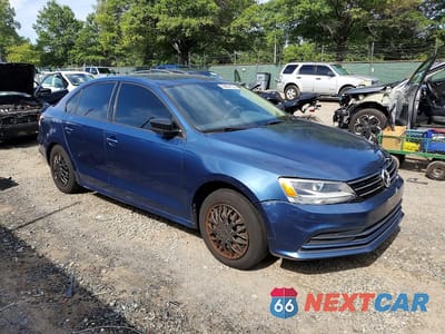 Czwarte zdjęcie samochodu z boku: 2016 VOLKSWAGEN JETTA S VIN:3VW267AJ9GM416169 - miniatura