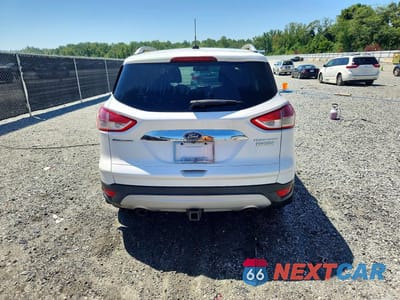Zdjęcie 6 z 12 samochodu: 2014 FORD ESCAPE TITANIUM VIN:1FMCU0J94EUE20287 - miniatura