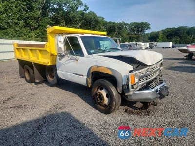 Czwarte zdjęcie samochodu z boku: 1999 GMC SIERRA DUMP TRUCK VIN:1GDKC34FXXF039004 - miniatura