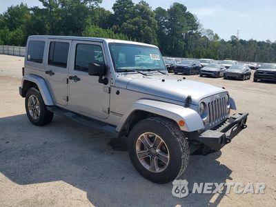 Czwarte zdjęcie samochodu z boku: 2013 JEEP WRANGLER UNLIMITED SAHARA VIN:1C4BJWEG1DL658395 - miniatura