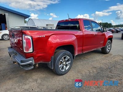Trzecie zdjęcie samochodu z tyłu: 2016 GMC CANYON SLE VIN:1GTH6CEA2G1389054 - miniatura